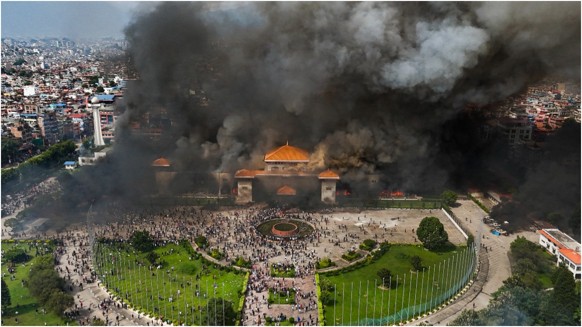 Burning buildings in Kathmandu as Gen Z protests intensify against government policies.
