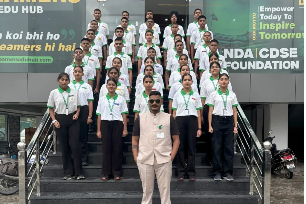 Anil Rawat standing proudly in front of the Dreamers Edu Hub
